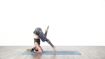 Yogi is practising yoga on a blue yoga mat on white background