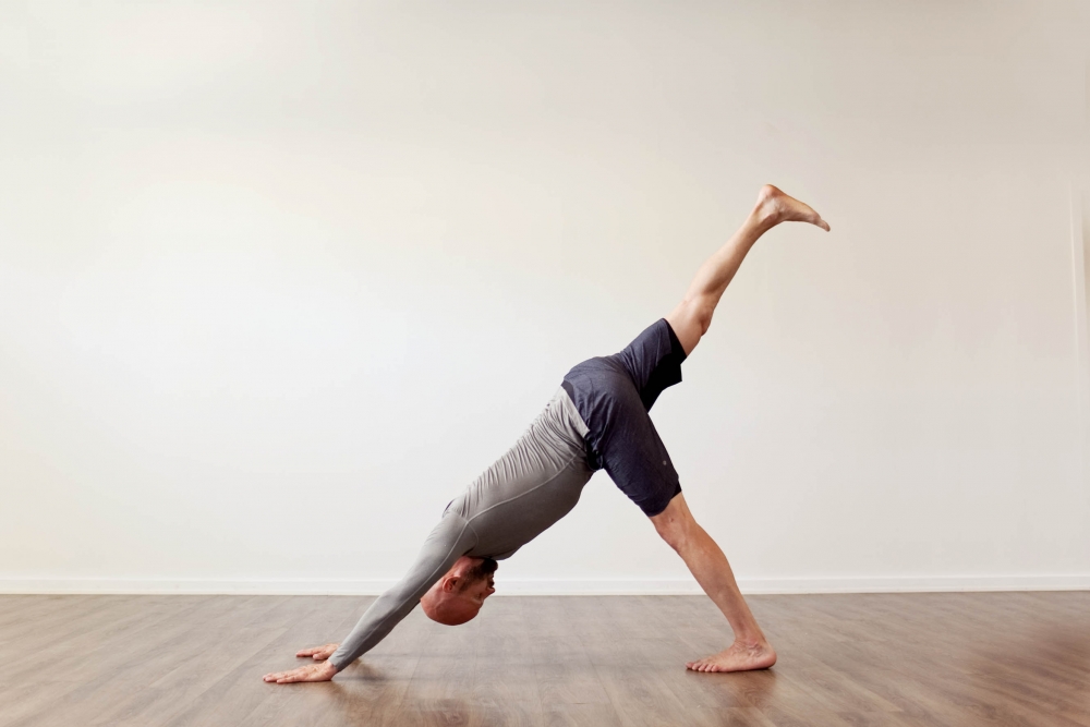 3 legged downward facing dog yoga posture