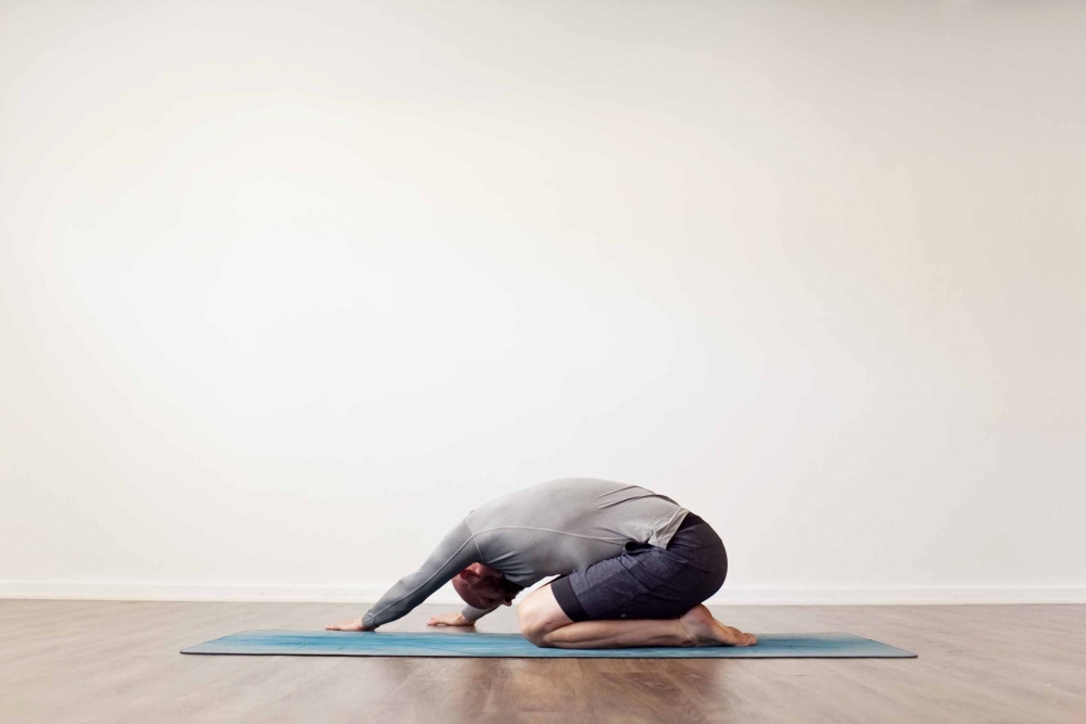 Childs pose with side stretch